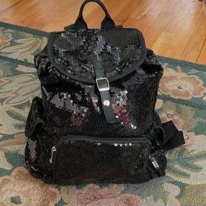 Black sequined backpack.